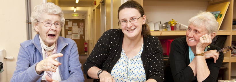 Image of older people with young person inbetween